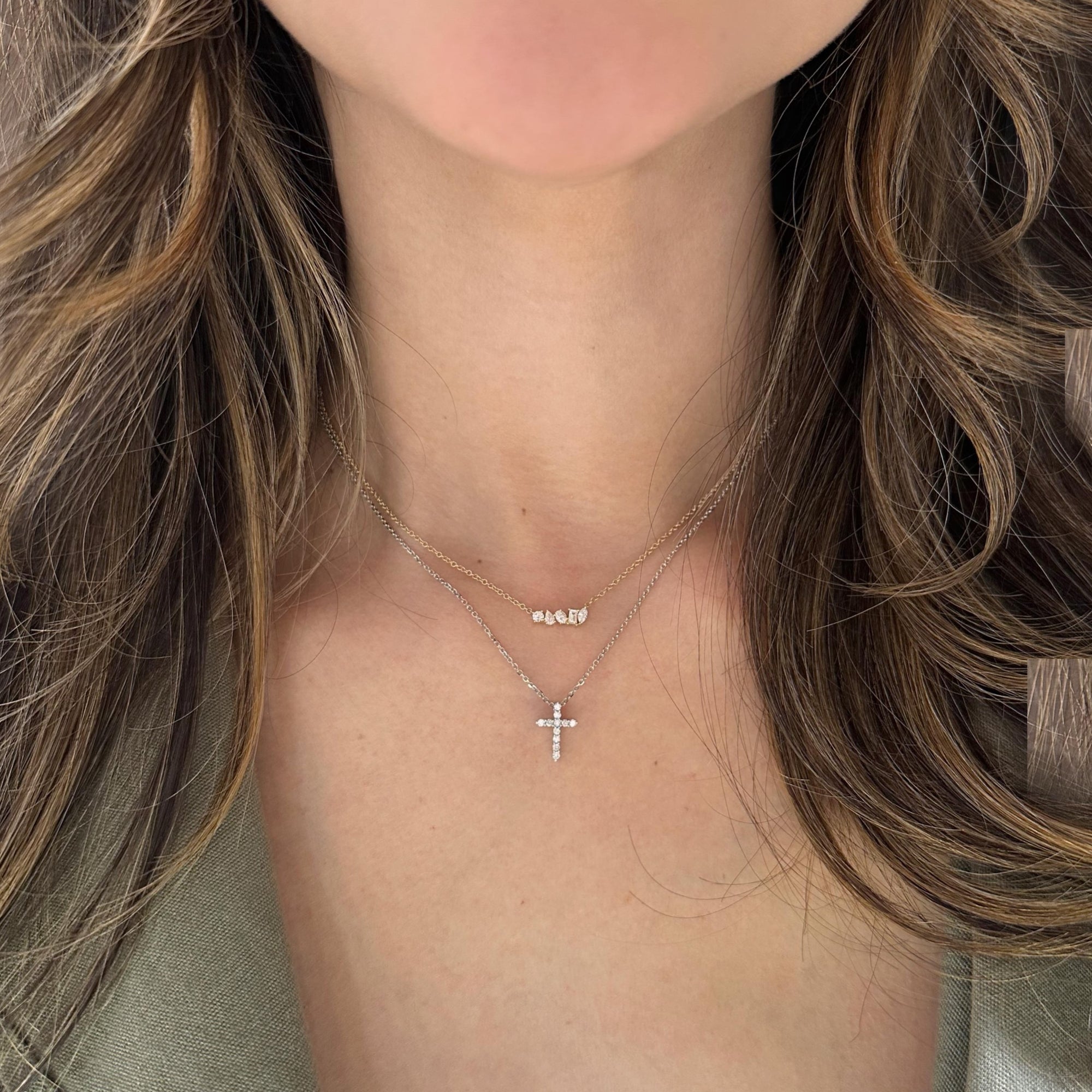 Diamond Small Cross Pendant -14K yellow gold weighing 2.03 grams  -11 round diamonds totaling 0.14 carats