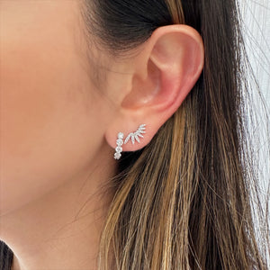 Female model wearing Diamond angel wing crawler earring - 14K gold weighing 1.28 grams
- 54 round diamonds weighing 0.25 carats