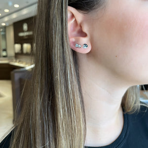 Female model wearing Diamond Yin Yang Stud Earrings - 14K gold weighing 1.16 grams
- 29 round diamonds weighing 0.07 carats
- 29 black round diamonds weighing 0.08 carats 