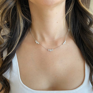 Female Model Wearing Diamond Disc Trios Necklace - 18K gold weighing 6.88 grams - 75 round diamonds weighing 1.36 carats