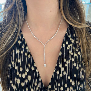 Female Model Wearing Pear-Shaped Diamond Lariat Necklace - 18K gold weighing 21.07 grams - 209 round diamonds weighing 3.23 carats 0.22 ct pear-shaped diamond