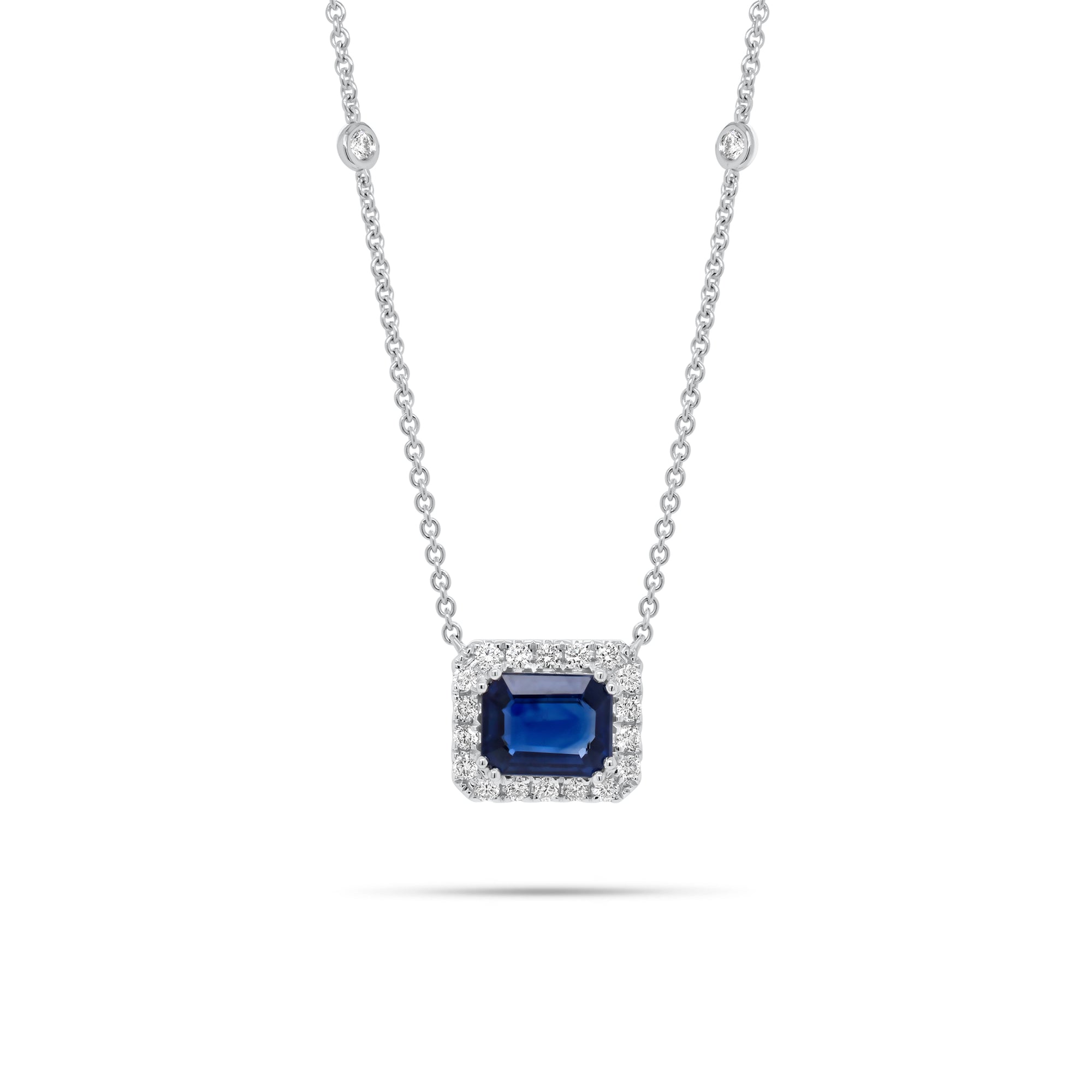 Emerald-Cut Sapphire Halo Diamond Pendant Necklace 18K gold weighing 4.79 grams  2.09 ct emerald-cut sapphire  - 22 round diamonds weighing 0.44 carats