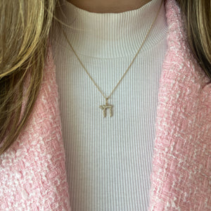 Female model wearing Pave diamond chai hebrew pendant- 14K gold weighing 2.60 grams
- 135 round diamonds weighing 0.23 carats chai hebrew pendant 