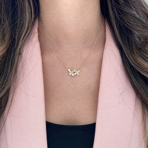 Female Model Wearing Diamond Flower Duo Pendant Necklace - 14K gold weighing 3.20 grams - 44 round diamonds weighing 0.18 carats