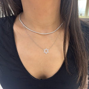 Female model wearing 0.37 ct Diamond Star of David Pendant Necklace - 14K gold weighing 2.30 grams  - 48 round diamonds weighing 0.37 carats