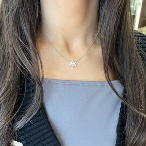 Female model wearing Gold star of david pendant with diamond heart - 14K gold weighing 2.65 grams
- 0.25 ct heart-shaped diamond