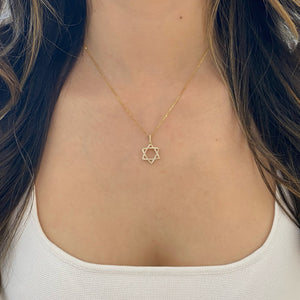 Female Model Wearing 0.37 ct Diamond Star of David Pendant - 18K gold weighing 1.43 grams - 14K gold weighing 1.60 grams - 59 round diamonds weighing 0.37 carats