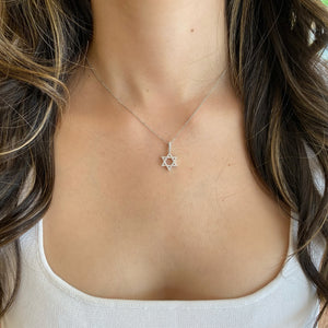 Female Model Wearing 0.24 ct Diamond Star of David Pendant - 18K gold weighing 1.41 grams - 14K gold weighing 1.60 grams - 54 round diamonds weighing 0.24 carats