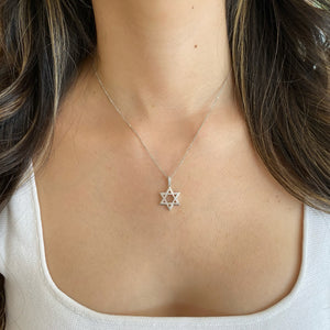 Female Model Wearing 0.24 ct Diamond Star of David Pendant - 18K gold weighing 1.41 grams - 14K gold weighing 1.60 grams - 54 round diamonds weighing 0.24 carats