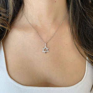 Female Model Wearing 0.22 ct Diamond & Gold Star of David Pendant - 18K gold weighing 2.14 grams - 14K gold weighing 1.60 grams - 31 round diamonds weighing 0.22 carats