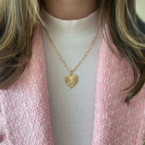 Female model wearing Fluted Gold Heart Pendant with Diamond Initials - 14K gold weighing 4.12 grams
- 44 round diamonds weighing 0.19 carats