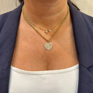 Female Model Wearing Diamond & Pink Sapphire Two-Hearts Pendant - 14K gold weighing 2.86 grams- 229 round diamonds weighing 0.71 carats - 19 pink sapphires weighing 0.08 carats