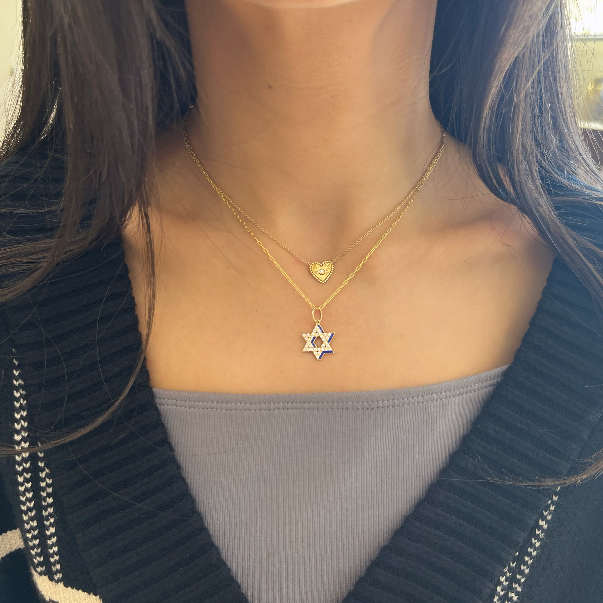 Diamond & enamel star of david pendant - 14K gold weighing 1.65 grams
- 33 round diamonds weighing 0.33 carats