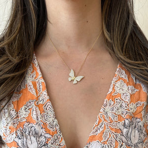 Female Model Wearing Diamond Fluttery Butterfly Necklace - 14K gold weighing 7.63 grams - diamonds totaling 1.45 carats