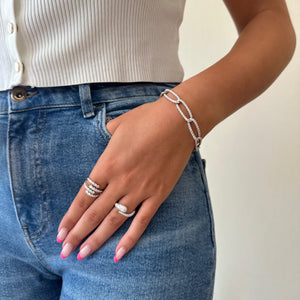 Female model wearing Diamond slim oval link bracelet - 14K gold weighing 11.38 grams
- 179 round diamonds weighing 5.27 carats