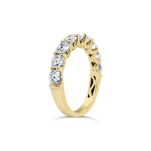 Shared Prong-Set Diamond Wedding Band  -18k gold weighing 3.29 grams  -9 round shared prong-set diamonds 1.68 carats