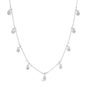 Diamond by the Yard Drip Necklace  - 14K gold weighing 6.25 grams.  - 9 round diamonds totaling 0.61 carats.