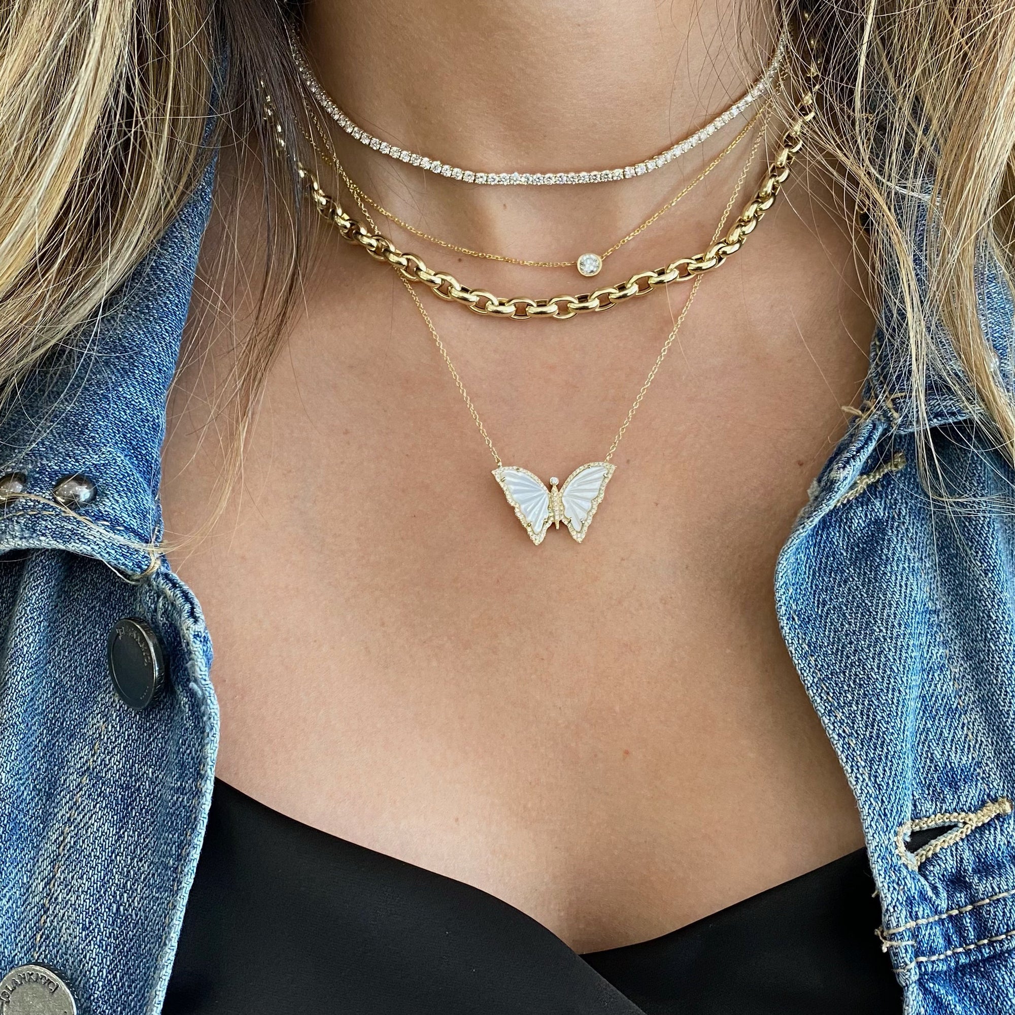 Mother of Pearl & Diamond Butterfly Pendant  - 14K gold weighing 3.10 grams  - 96 round diamonds totaling 0.22 carats  - 2 Mother of Pearl slices